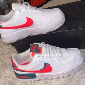 Blue, pink Nike shoes